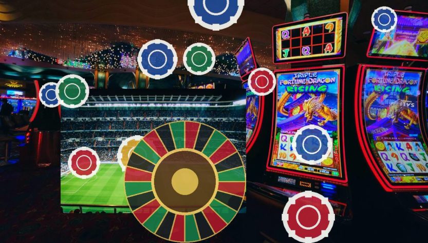 Hazbet-Giris-Linki-Guvenilir-mijpg - Hazbet Giriş Sitesi, Güncel Hazbet sayfası Casino interior with a large roulette wheel, slot machines, and a bright stadium-style screen in the background.