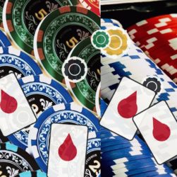 Colorful casino chips piled with two playing cards showing red teardrop symbols, suggesting gambling risk.